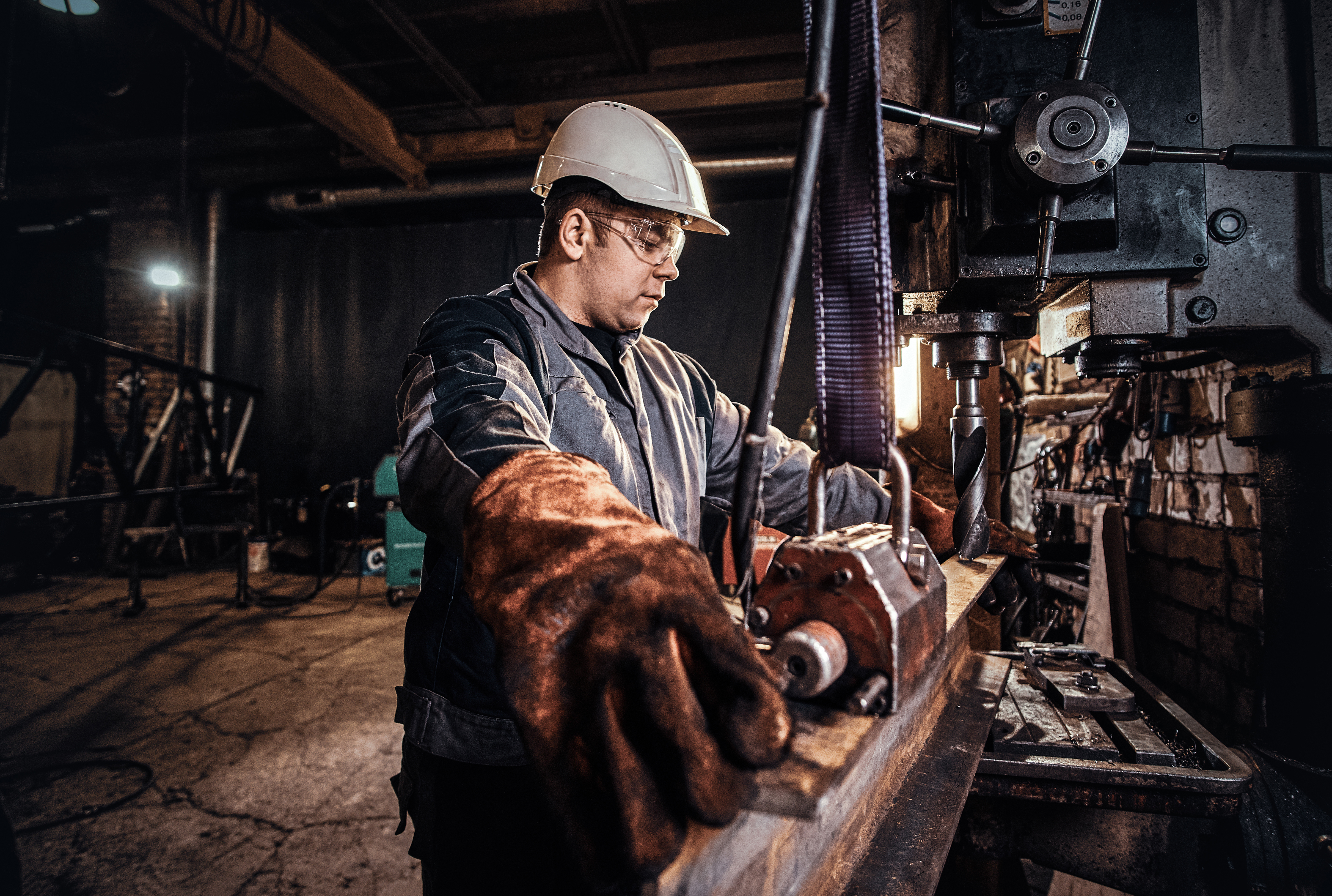 Skilled worker operating heavy machinery in an industrial plant